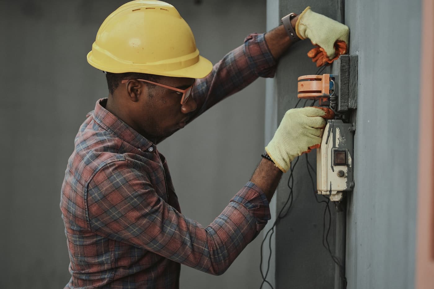 Technicians in protective gear using outdoor fogging equipment